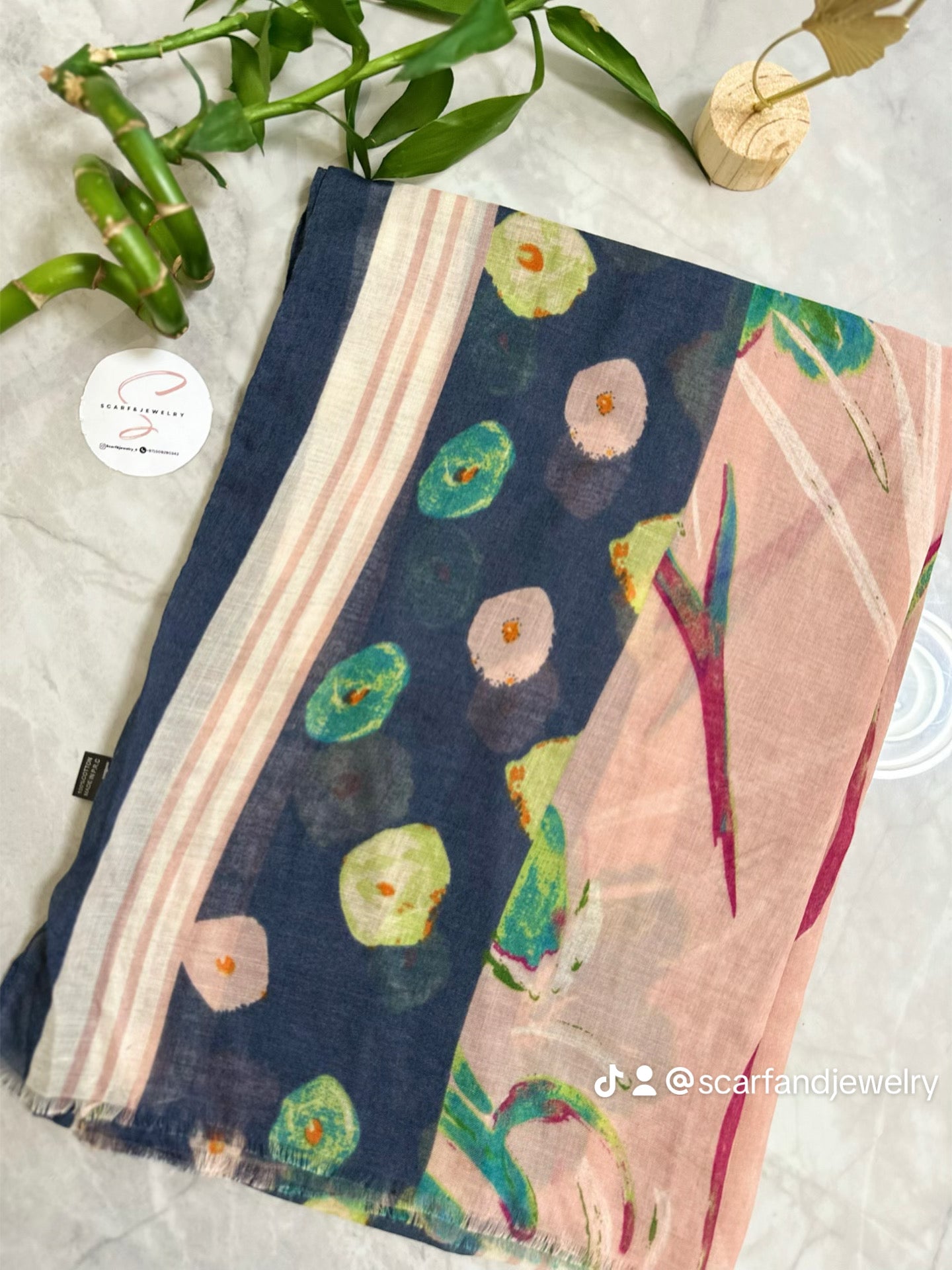 Colorful scarf with floral patterns on a light background